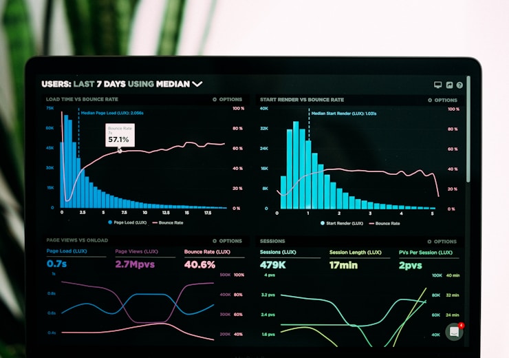 Person holding a smartphone checking social media performance and engagement metrics