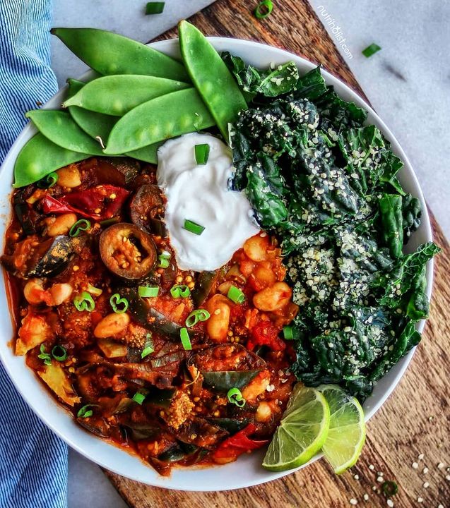 Rainy days call for comfort food like this delicious SMOKY EGGPLANT & BEAN RAGOUT 💯 This heartwarming meal bursts with flavor and is super simple, quick, and easy to prepare. Here I'm serving it with a dollop of plain organic yogurt and a side salad. But I also love having it with brown rice, quinoa, or sourdough bread.👌🏼 For the salad, I used black kale massaged with extra-virgin olive oil + lime juice, ume plum vinegar, and hemp hearts. 🌱 
.
You can snag the recipe on the blog (link in my stories or search for 