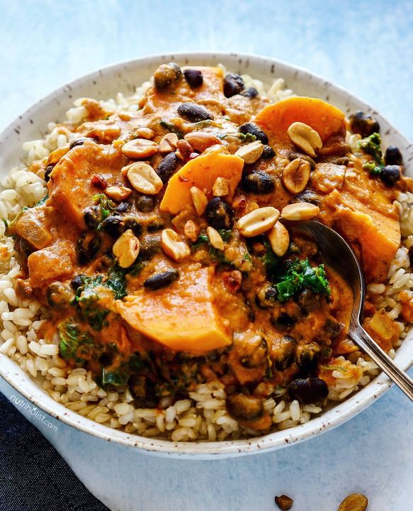 West African Peanut Stew served over brown brown saffron rice 🤤 A great example of a delicious meal that's balanced with protein, healthy fats, and fiber 👊🏼 Everytime you're preparing a meal ask yourself, do I have these 3 key components? Missing either one can lead to nutritional deficiencies down the road. Some examples of #plantbased protein are lentils, chickpeas, beans, edamame, tofu, tempeh, green peas, nuts, seeds (including chia seeds and hemp hearts), quinoa, and amaranth. 
.
You can also make your meals more nutritious by adding several types of vegetables. Whether you're making a stew, pasta, or a stir-fry, there's always room for more veggies.🌱 Think mushrooms, zucchini, broccoli, cauliflower, spinach, kale, chard, collard greens, sweet potato, squash, carrot, eggplant, and the list goes on... 🥦🍠🥒🥬
.
What are some of your favorite ways to bump up the nutritional value of your meals? Would love to know! Have a great one friends, it's almost the weekend 😍